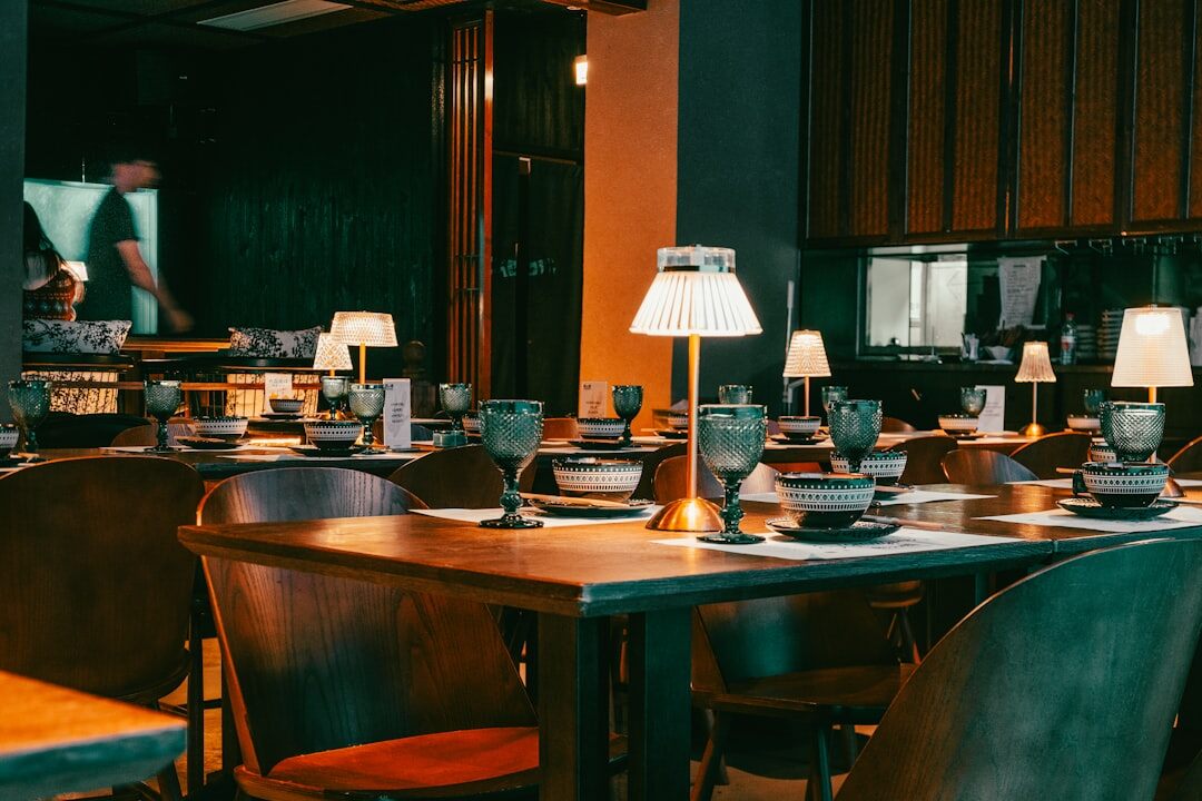 Elegant restaurant interior with warm lighting and set tables
