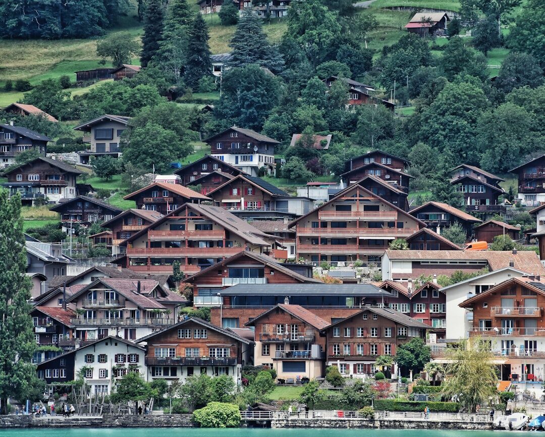 Traditional Swiss alpine village with wooden chalets and mountains