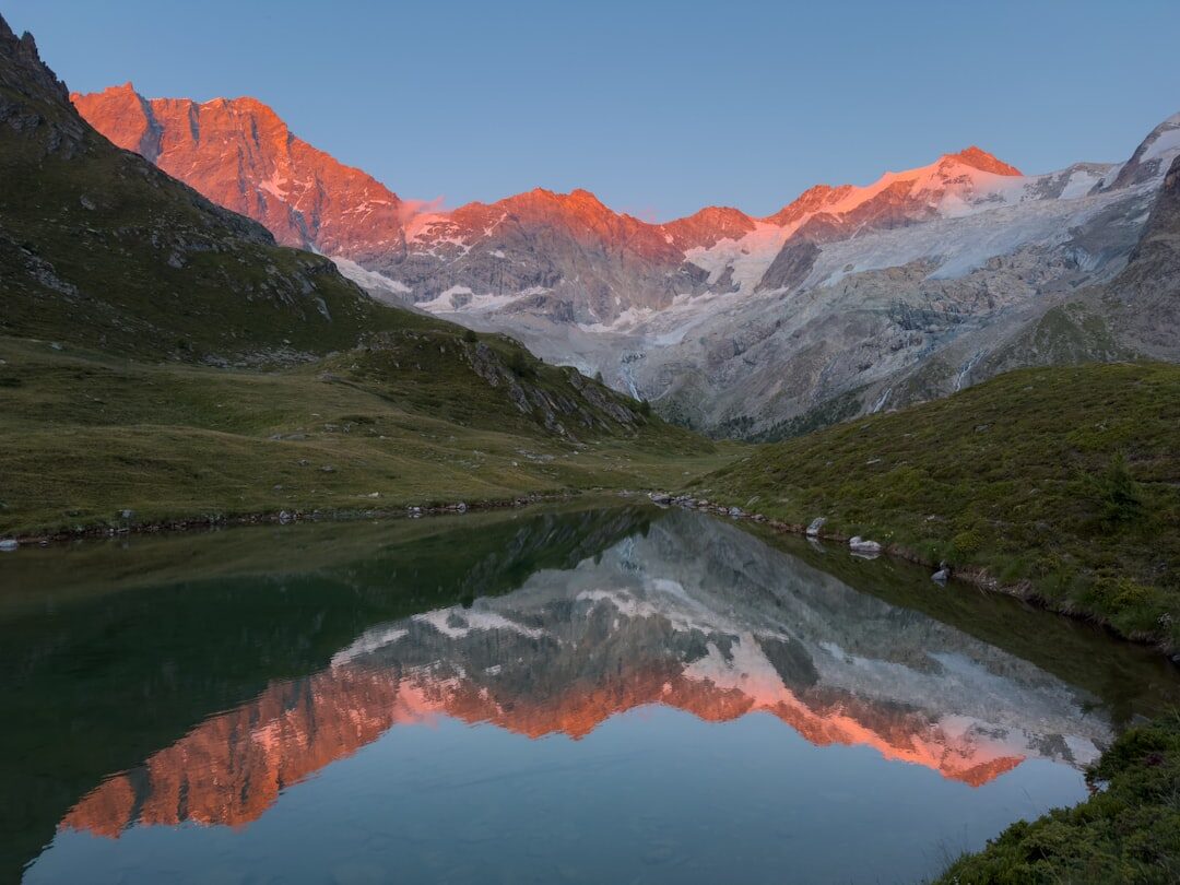 Snow-capped Matterhorn mountain reflected in an alpine lake in Switzerland